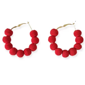 Small red woven ball hoop earrings by Narratives The Line
